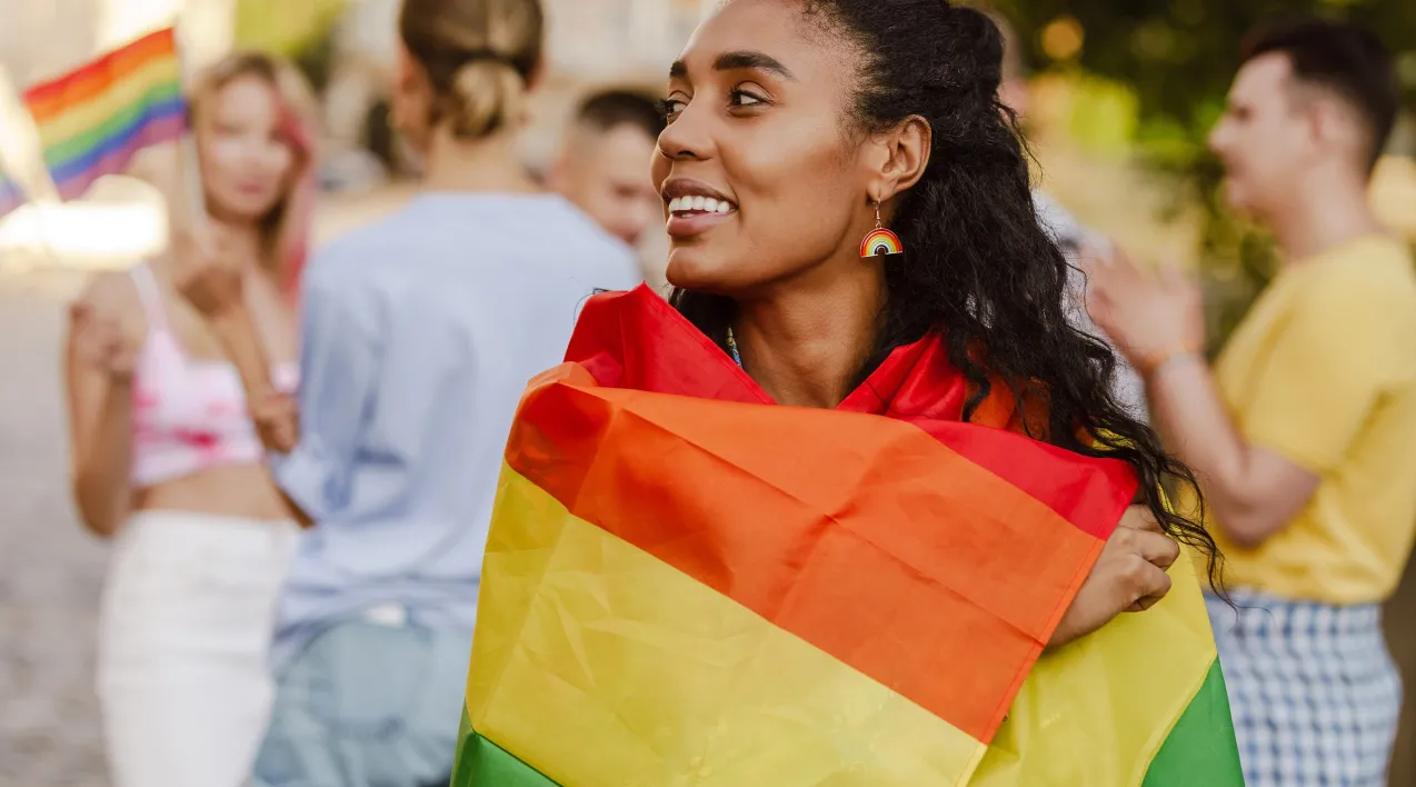 Woman wrapped in pride flag